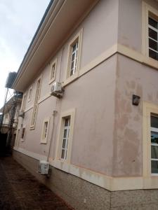 a white building with windows on the side of it at 5-bedroom fully detached duplex in Enugu