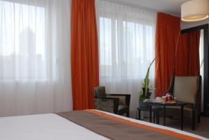 Postel nebo postele na pokoji v ubytování Mercure Lyon Centre - Gare Part Dieu