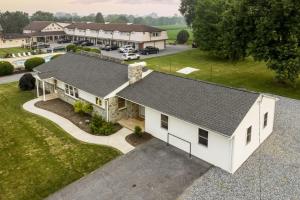 an aerial view of a white house with a driveway at New! Cozy Family Getaway: Amish Farmland|Patio|Washer & Dryer|Central Lancaster County in Ronks