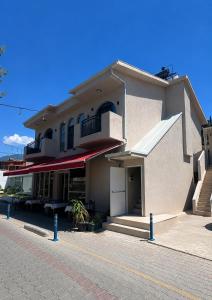 a building with a parking lot in front of it at Miralya Downtown in Fethiye