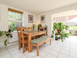 a dining room with a wooden table and chairs at Manning's View in Barnstaple