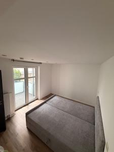 a bedroom with a bed in a room with a window at PaderQuartier2 in Paderborn