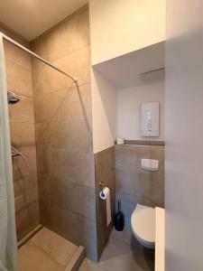a bathroom with a shower and a toilet at PaderQuartier2 in Paderborn