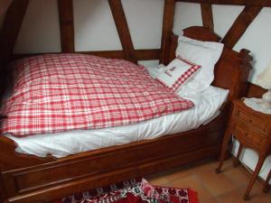 Postel nebo postele na pokoji v ubytování Chambre d'Hôtes "Au Vigneron"