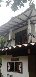 a balcony of a house with a balcony at 53 Villa in Habaraduwa Central