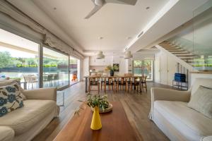 a living room with a couch and a table at Modern Villa Olivera with Private Pool in Calella de Palafrugell