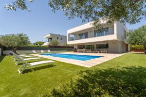 an image of a house with a swimming pool at Modern Villa Olivera with Private Pool in Calella de Palafrugell