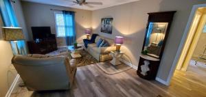 a living room with a couch and a chair at Charming Country Cottage in Murfreesboro