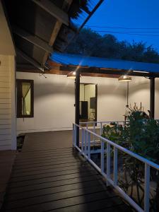 a porch of a house at night at Bakesense home 01 in Ko Phangan