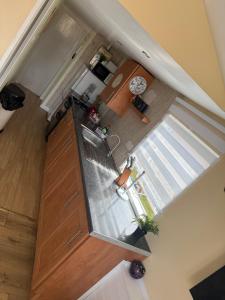an overhead view of a kitchen with a refrigerator at The Butterfly in Leysdown-on-Sea