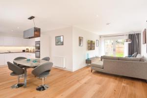 a living room with a table and a couch at Westview in St. Andrews