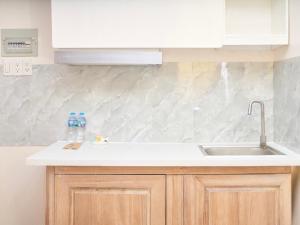 a kitchen with a sink and a counter top at ROSE Appartment in Ho Chi Minh City +33 photos