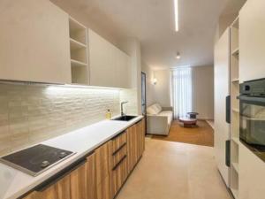 a kitchen with a sink and a stove top oven at Cosy place in Pembroke in Pembroke