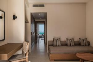 a living room with a couch and a table at JAZ Elite Riviera in Port Ghalib