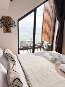 a bedroom with a bed and a table and chairs at Divcibare Vrh 26 in Divčibare
