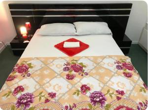 a bed with a red heart on top of it at Disney golden house in Magny-le-Hongre +9 photos