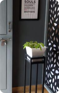 a stool with a potted plant on it in a room at The bharani villa in Pulpally