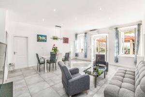 a living room with a couch and a table at Villa Adriatic Pearl in Dubrovnik