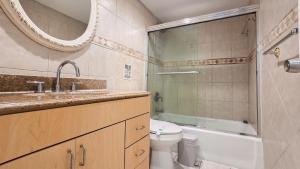 a bathroom with a sink and a toilet and a mirror at THE TIDES 1 bedroom apt 8th floor WE ARE ON THE BEACH in Hollywood