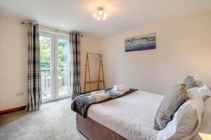 a bedroom with a bed and a window at 3 Bed in Sandsend oc-wa081 in Sandsend