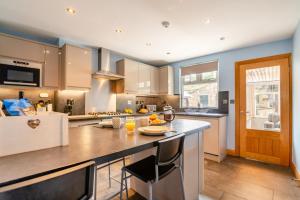 a kitchen with a large island in the middle at 3 Bed in Sandsend oc-wa081 in Sandsend +31 photos