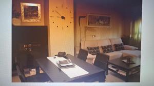 a living room with a table and a couch at Destino eclipse Burgo de Osma in El Burgo de Osma