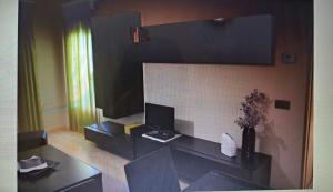 a living room with a desk with a computer on it at Destino eclipse Burgo de Osma in El Burgo de Osma