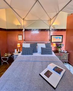 a bedroom with two beds with blue and white pillows at Palais El Arsat & Spa in Marrakesh +71 photos