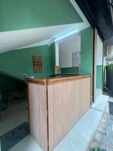 a counter in a room with a mirror at Cozy Rooms & Dormitory in Kozhikode