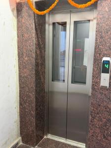 an elevator in a building with an orange rope at Prakash Bhawan in Darbhanga