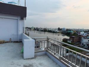 a balcony of a building with a view of a river at Prakash Bhawan in Darbhanga