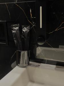 a vase sitting on top of a bathroom sink at Boho House Florina in Florina +3 photos