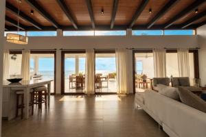 a living room with a couch and a table at Jama Campay Hotel by Otium in Los Camarones