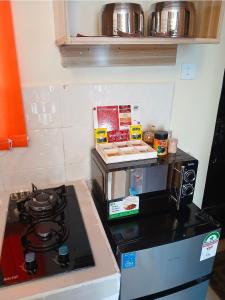 a kitchen with a stove and a counter top at Haven Nest in Machakos