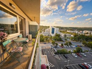a balcony with a view of a parking lot at CENTRAL Apartment 84- free parking- spital Recuperare in Iaşi