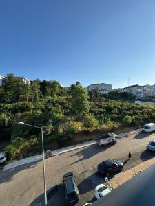 a parking lot with cars parked on a street at Dream Hotel in Trabzon