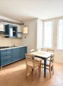 a kitchen with a table and chairs and a sink at Residence Del Casalnuovo in Matera +54 photos
