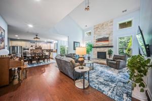 a living room with a couch and a fireplace at The Blue Crown Manor at Concord Estates in Concord