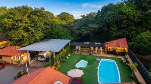 an aerial view of a house with a swimming pool at Roxys Inn in Boca Chica