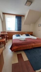 a large bedroom with two beds and a window at Hotel Sutoris in Bochnia +89 photos