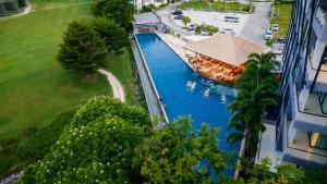 an overhead view of a river with boats in it at The Par Phuket Hotel in Kathu