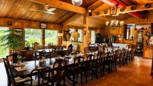 a restaurant with tables and chairs in a room at Top Notch Motel in Wiarton +14 photos