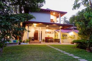 a house with a lawn in front of it at Kasitha Ocean View Villa - Matara Beach Road in Matara