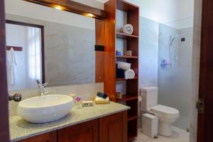 a bathroom with a sink and a toilet at Kasitha Ocean View Villa - Matara Beach Road in Matara +29 photos