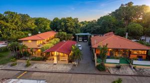 an overhead view of a house with a parking lot at Roxys Inn in Boca Chica