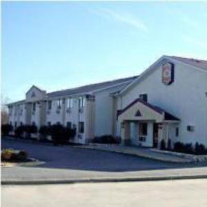 a large white building with a street in front of it at Americas Express Inn Rocky Mount in Rocky Mount