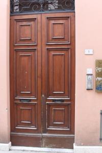 a large wooden door on the side of a building at Bonbon in Treviso