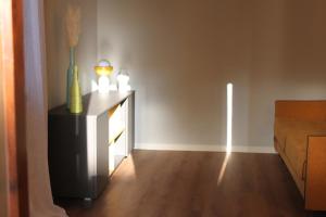 a living room with a table with a vase and candles at Bonbon in Treviso