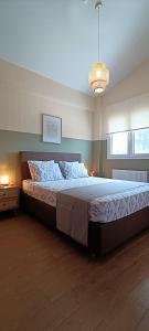 a bedroom with a large bed in a room at Country Nest in Messini