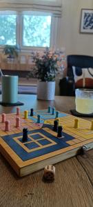 a wooden chess board on top of a table at Country Nest in Messini